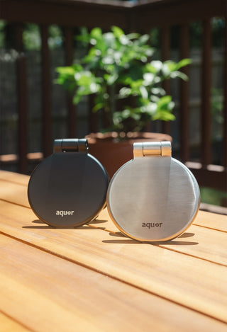 From left to right, the matte black v1+ debris cover, the brushed stainless v1+ debris cover.