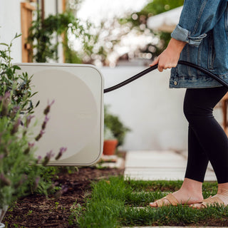 Women pulling out hose reel