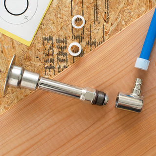 A photo of the Aquor house hydrant, half inch PEX expansion elbow inlet, and PEX line, demonstrating where the inlet spins off.