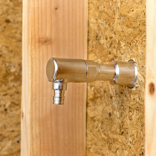 A half inch elbow PEX expansion inlet connected to the backend of a Aquor house hydrant.