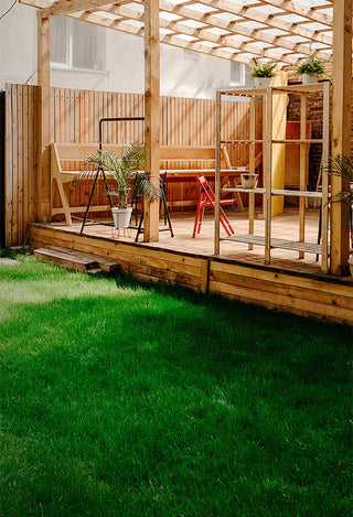 A wooden backyard patio
