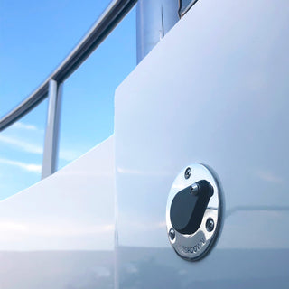 A close up view of the marine deckwash on a boat's deck-wall.