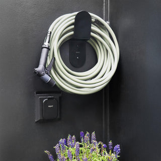 Aquor Ultralight Garden Hose and Utility Spray Nozzle hanging on Matte Black Hose Hanger