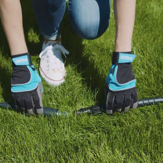 A woman connects the hose adapter to turn on her sprinkler.