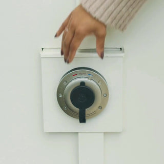 A front view of the Hot and Cold Hydrant with a hand turning the temperature dial. 