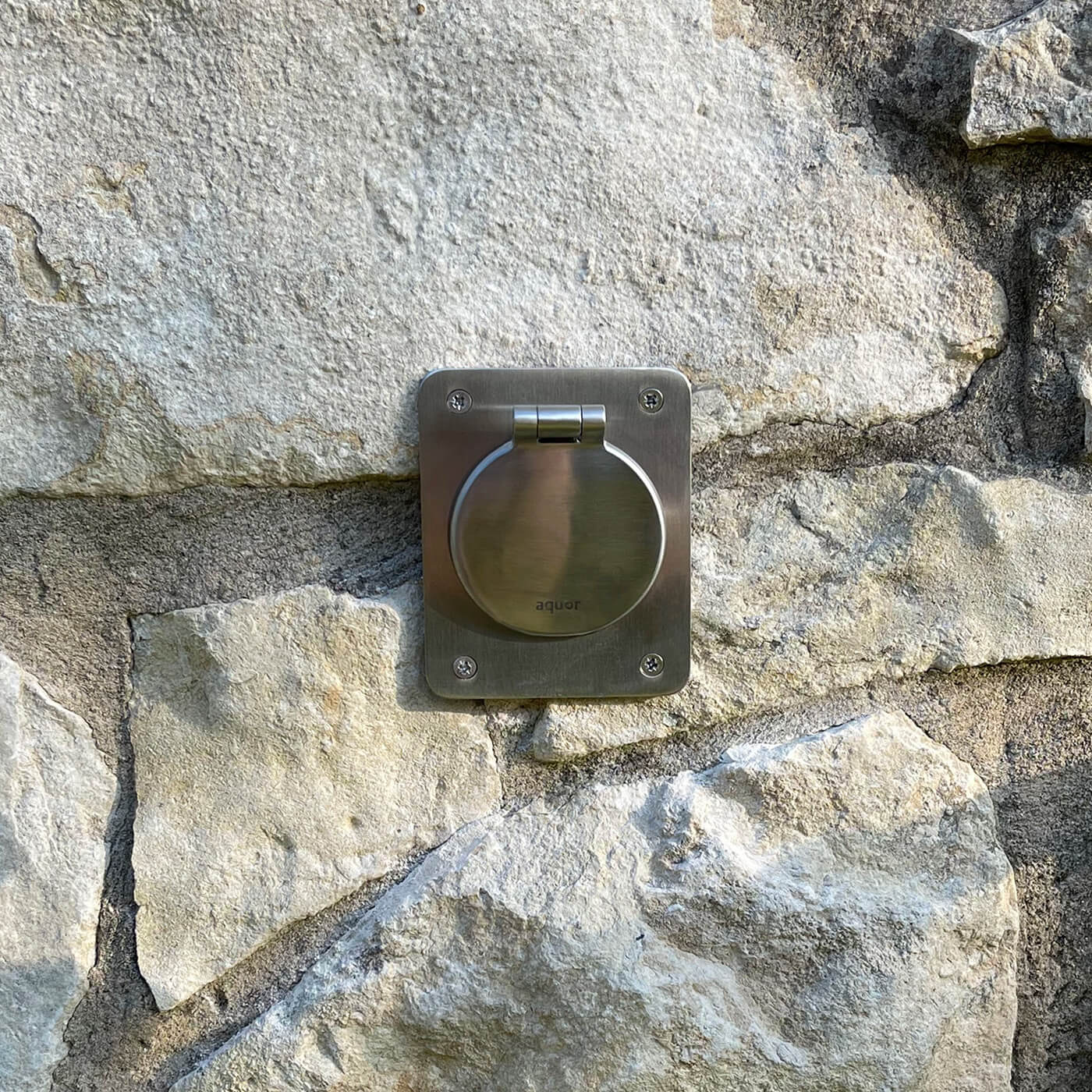 Stainless Steel Mounting Plate V1+ installed on stone with a House Hydrant V1+ Brushed Stainless Model